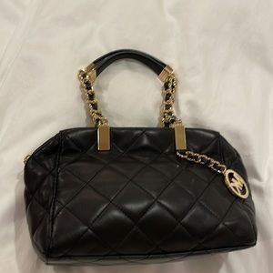 Michael Kors black leather diamond pattern bag comes with strapPerfect condition